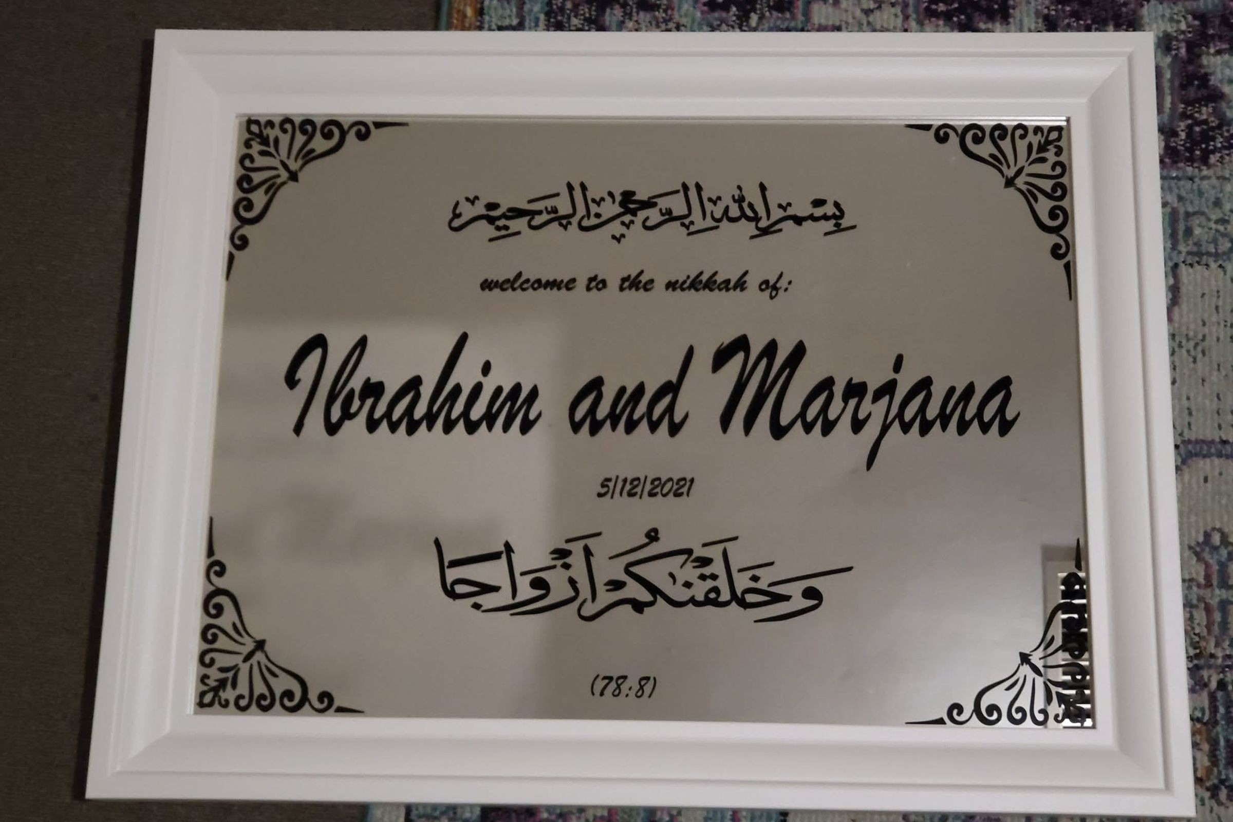 A wedding welcome sign carrying names, date and verse